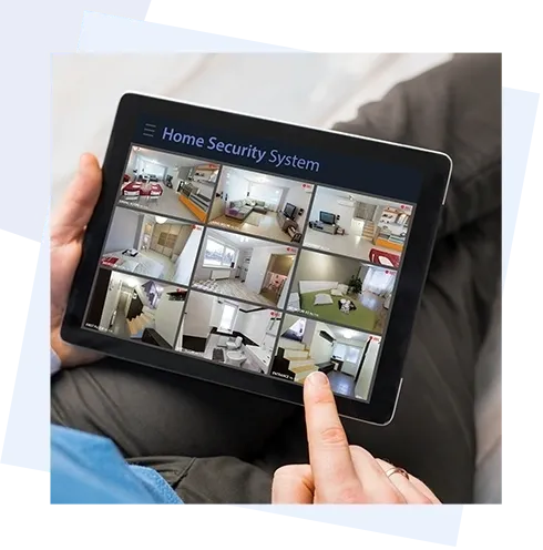 A person is holding an ipad with a home security system on it.